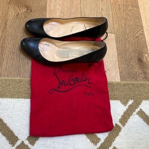 Christian Louboutin black leather pumps.